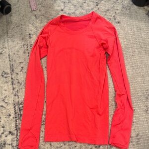 Lululemon woman’s  Red Long Sleeve Top partial sun protector